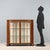 Art Deco display cabinet in mahogany veneer. Curved front with a pair of tripartite glass doors, glass sides, and curved...