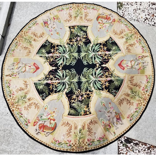 This large hand knotted wool needlepoint Aubusson-style tapestry rug featuring exotic jungle scenes and desert motif in...
