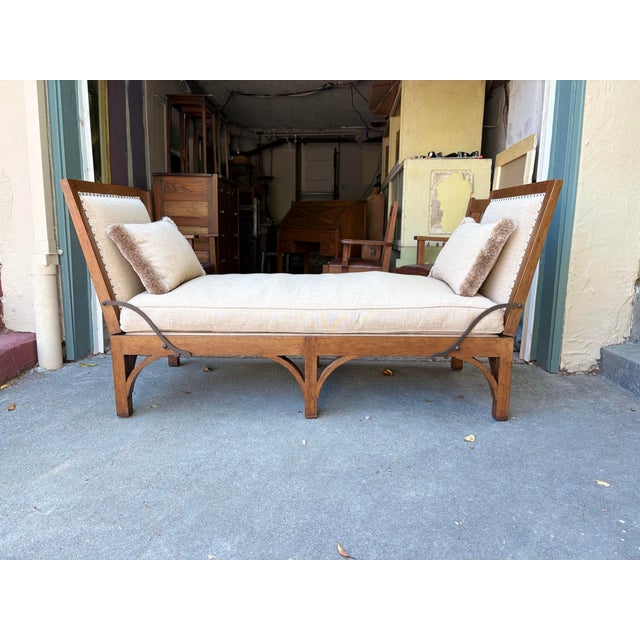 Gorgeous daybed with adjustable sides and aged iron hardware. The fabric is a neutral textured linen with matching gimp...