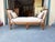 Gorgeous daybed with adjustable sides and aged iron hardware. The fabric is a neutral textured linen with matching gimp...