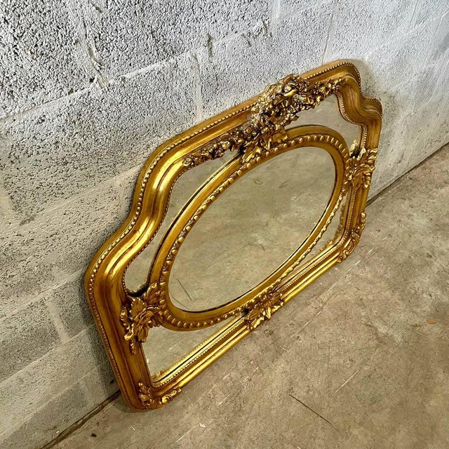 This Baroque style vintage gold wall mirror is a stunning statement piece that showcases exquisite craftsmanship and...