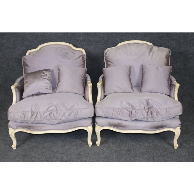 This handsome pair of Century Furniture bergère lounge chairs embodies the timeless sophistication of French Provincial...
