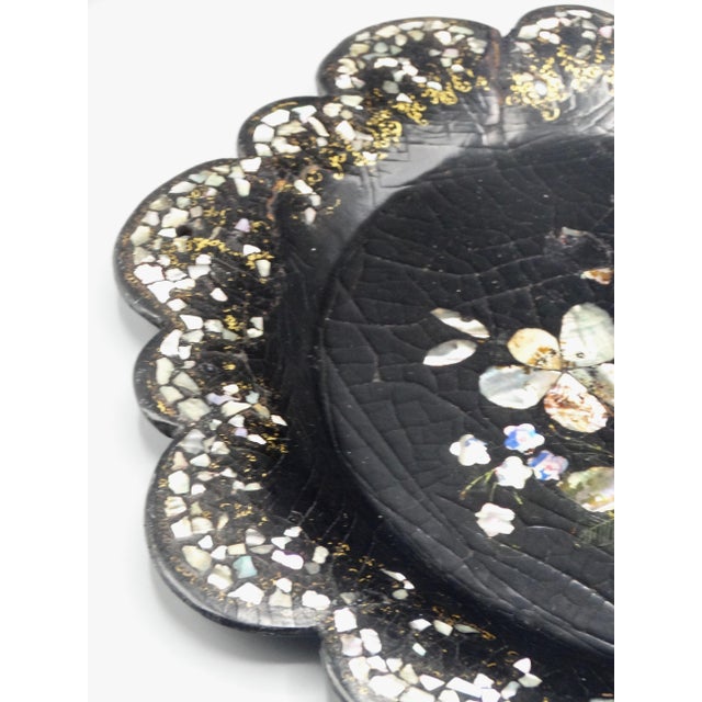 Lovely 19th-Century handcrafted papier mache tray or wine coaster inlaid with mother of pearl and abalone shell. It is a...
