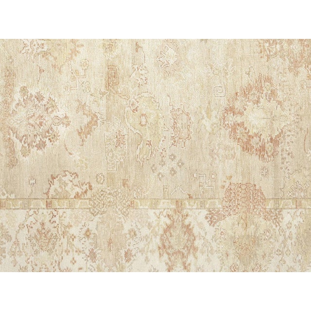Expertly handwoven in the Oushak region of Western Turkey, this Vintage Turkish Oushak Rug boasts a wool on wool...