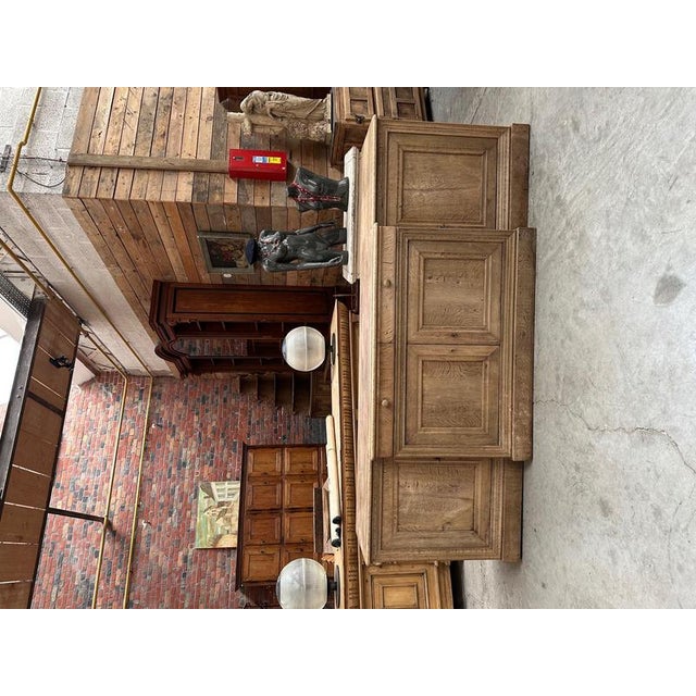 This antique solid oak sideboard has been fully restored. It features four large lockable doors that open to reveal...