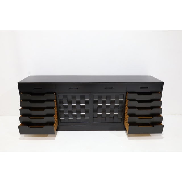 Fully restored 4 door sideboard with basket weave front designed by Edward Wormley for Dunbar, circa1960's. The...