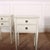 Pair of early 20th Century Swedish two drawer bedside tables with later paint. This piece is designed in the style of the...