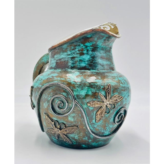 Striking and highly collectible sculptural water pitcher designed by renowned Mexican silversmith Emilia Castillo,...