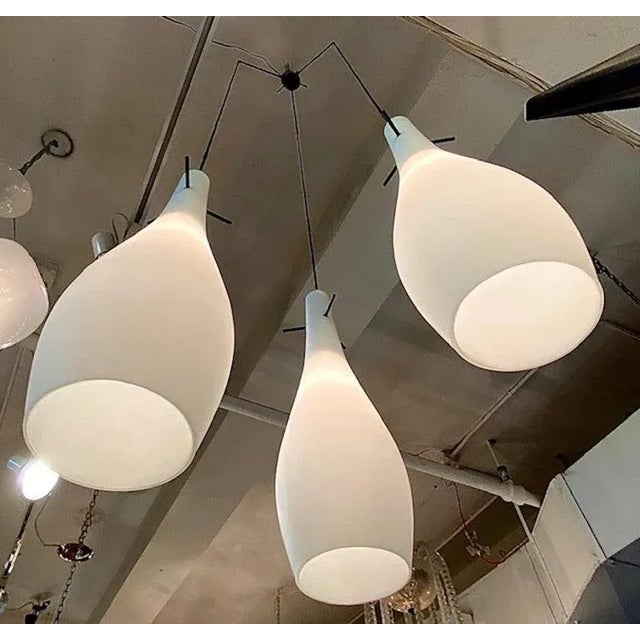 A gracefull and architectural Italian 1950s chandelier consisting of three pear shape case glass shade. Each shade is hand...