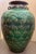 Guci sisik naga, also known as a dragon scale jar, is a type of antique storage jar, from China, with a distinctive...