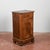 This single bedside table, crafted from solid wood and veneered with inlays, is a period piece reminiscent of a classic...