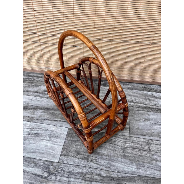 Vintage Mid Century Modern Rattan Bamboo Magazine Rack in the Style of Franco Albini. Circa 1970s. Features an arched...