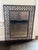 Decorative wrought iron wall mirror featuring an elegant scrolling motif and bronze finish. The intricate openwork frame...