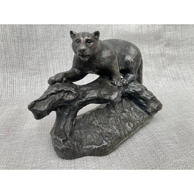 Vintage Henry Van Wolf bronze cougar sculpture. Cougar standing on a downed tree. Signed on the back base. Henry Van Wolf,...