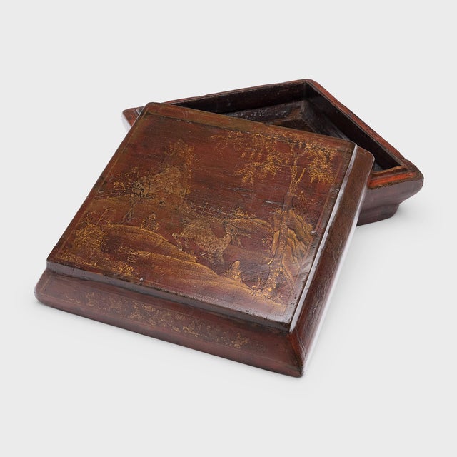 This wooden Chinese box is a 19th-century snack box, once presented as a gift for a holiday or special occasion. To the...