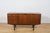 This elegant sideboard was manufactured in the 1960s by the renowned scottish furniture maker a.h. Mcintosh & co. Of...