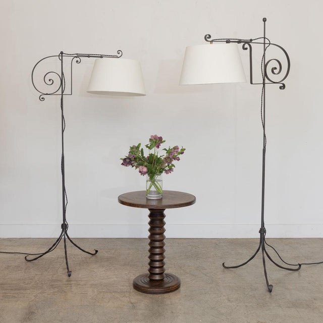 Stunning wrought iron floor lamp from France, 1940s. Beautiful black iron with twisted iron tripod base with thin stem....