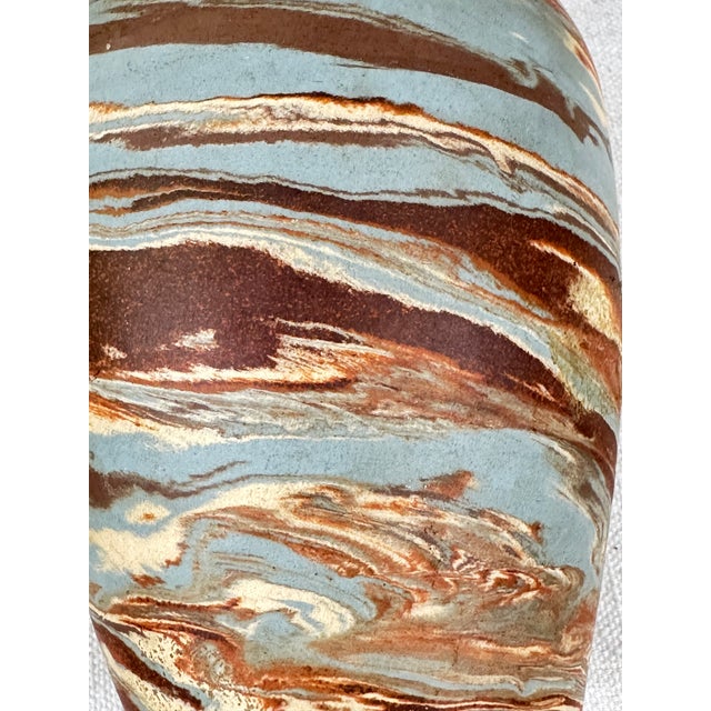 Vintage Niloak mission swirl pottery vase featuring a marbled design of blue, brown, and rust clays. This is a pre-owned...