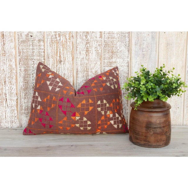 This colorful and luxurious Bagh Phulkari pillow features beautiful hand-done silk embroidery on top of a cotton fabric....