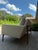3 seat sofa. Sofa features an exposed solid walnut frame that wraps around the back to support the seating area. It is...