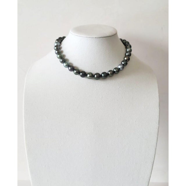 Introducing an elegant necklace crafted from natural, high-quality black Tahitian pearls length 17.5" (44.5 cm). This rare...