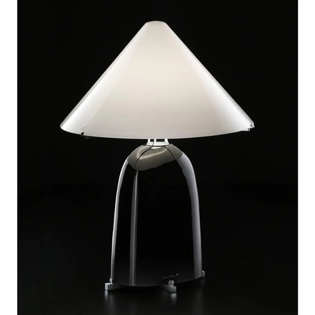 Chosen as one of Architectural Digest "best new lights, 2015", Ovale is a table lamp of black mouth blown Murano glass and...