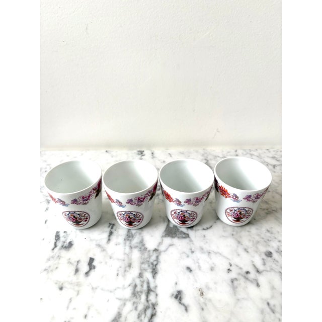 Lovely set of Limoges France hand, painted porcelain cups set of four. Stunning, detailed floral design.