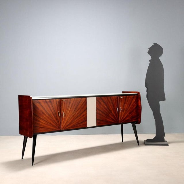 This elegant 20th-century Italian cabinet features hinged doors with a beautiful exotic wood veneer and concentric...