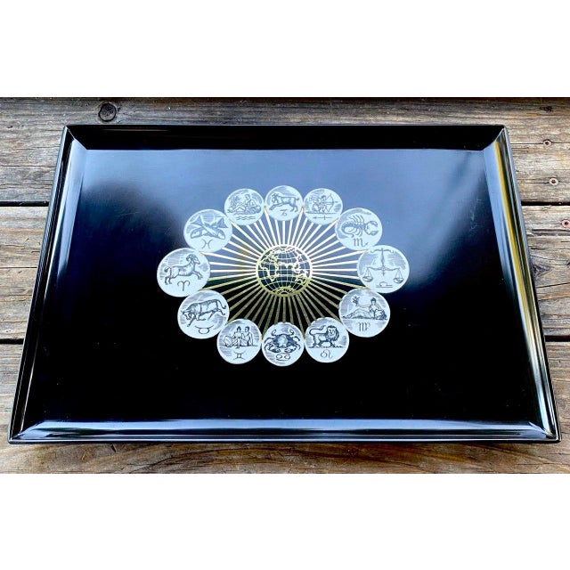 A dramatic vintage Couroc of Monterey astrological tray centered by a terrestrial globe surrounded by a radiant metallic...