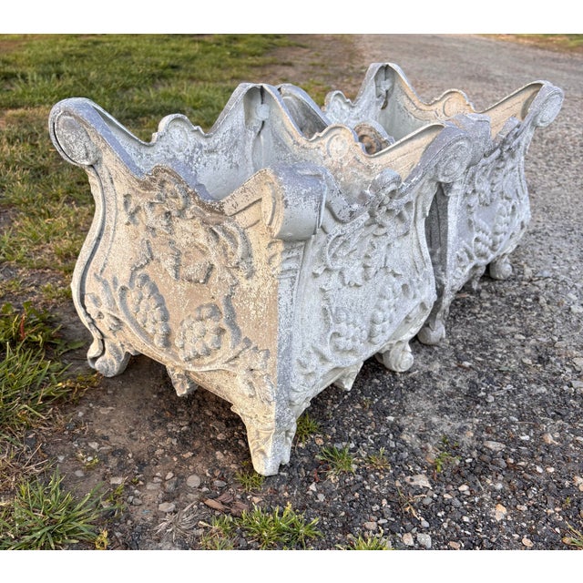 Stunning set of antique French cast iron jardinieres/planters. They have the original paint which has turned into a lovely...