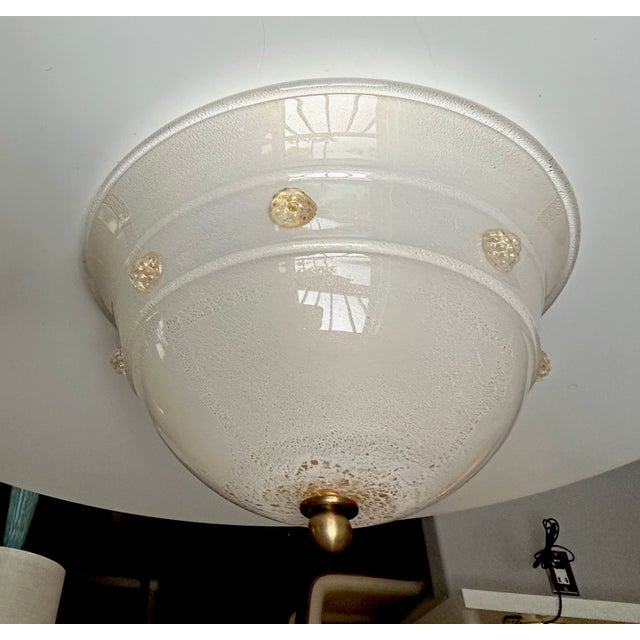 Flush mount ceiling light by Barovier & Toso. Thick opaque glass covered by clear glass with fine scattering of gold...