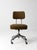 A mid-century industrial office chair featuring a clean, utilitarian silhouette and warm olive upholstery. The four-star...