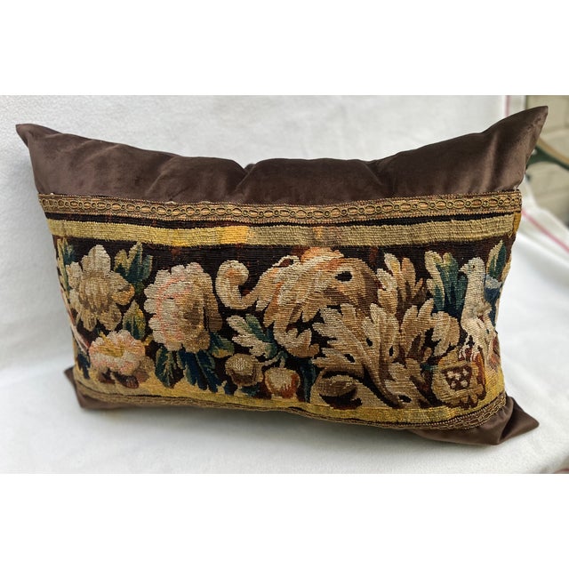 This decorative pillow is upholstered with an authentic 18th-century tapestry, showcasing 2 beautifully detailed birds...