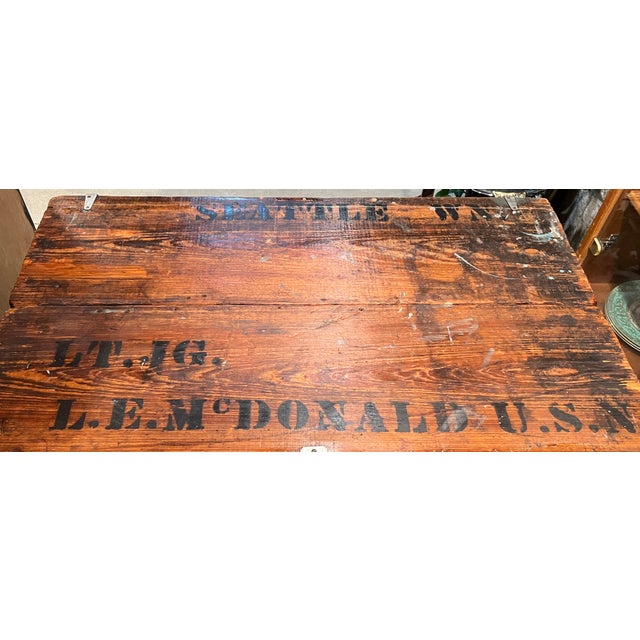 A wonderfully authentic World War II era U.S. Navy sailor’s wooden footlocker trunk, still bearing its original hand-...