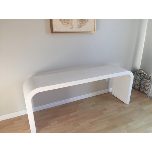 High end console wrapped in white faux ostrich leather. Good clean vintage condition. There are a total of three tears,...