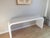 High end console wrapped in white faux ostrich leather. Good clean vintage condition. There are a total of three tears,...