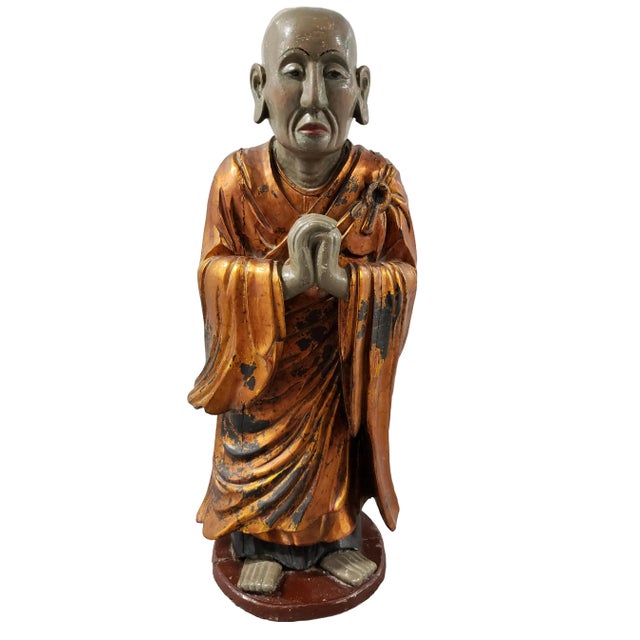 A pair of Vietnamese wood statues of Buddhist monks. They represent Ananda (younger) and Kashyapa (older). Polychrome...