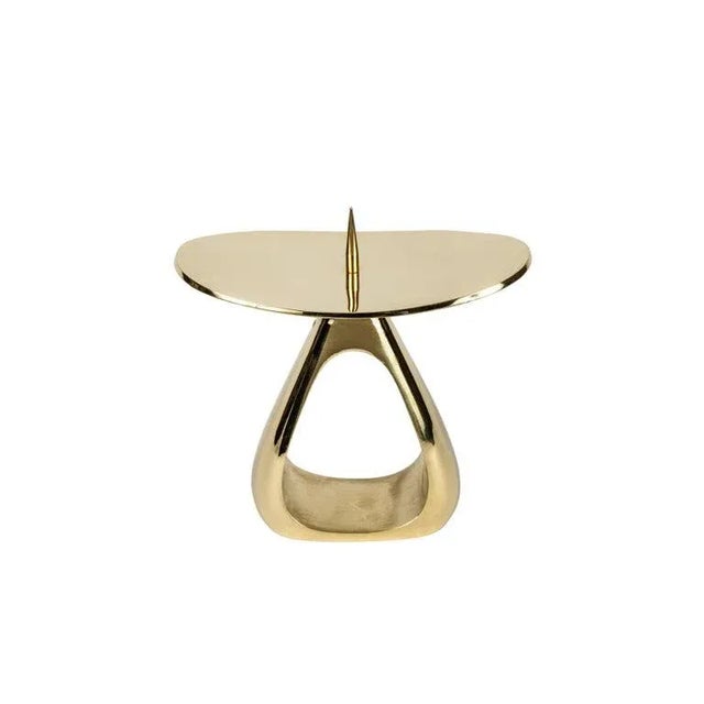 Carl Auböck #3470 polished brass candleholder- a pair. Designed in the 1940s, this incredibly clean and refined Viennese...