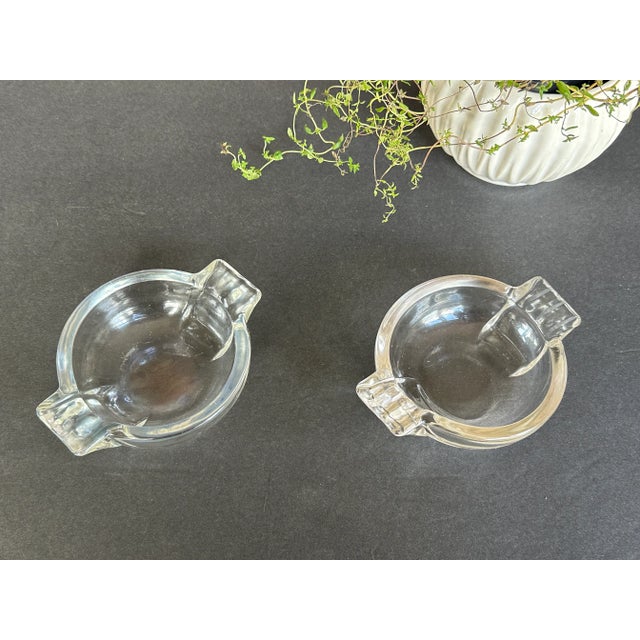 Use these vintage Art Deco era glass ashtrays as decorative catchall dishes or trinket trays on a hallway console, living...