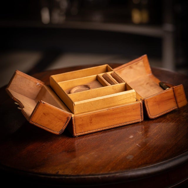 Antique 20th century victorian leather jewellery case, crafted from calf leather with a brass locking mechanism, key, and...