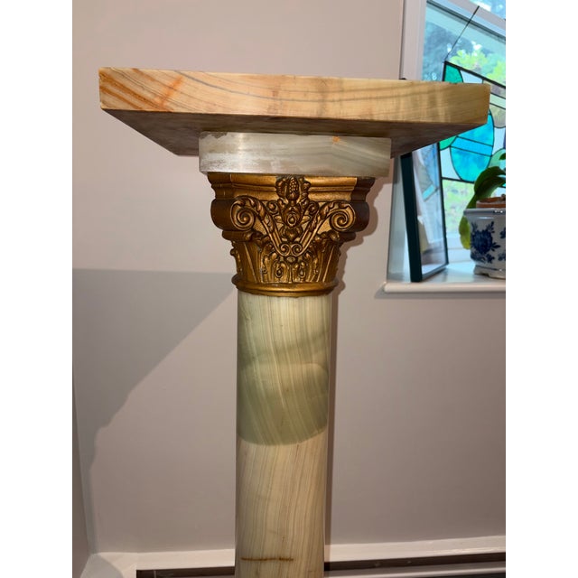 This elegant neoclassical pedestal is crafted from polished green onyx accented with gilded metal mounts. It features a...