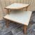 Vintage Mid Century Modern Two Tiered Rattan Corner Table. C 1950s Features a quintessential Mid Century Modern Design,...