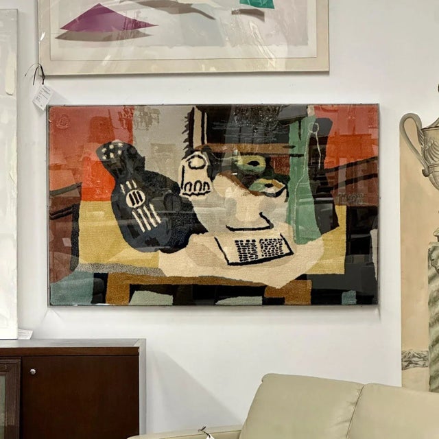 Framed Rug, Picasso's 'Guitar, Glass, and Fruit Dish' Decorative Art A wonderfully done abstract carpet in the manner of...