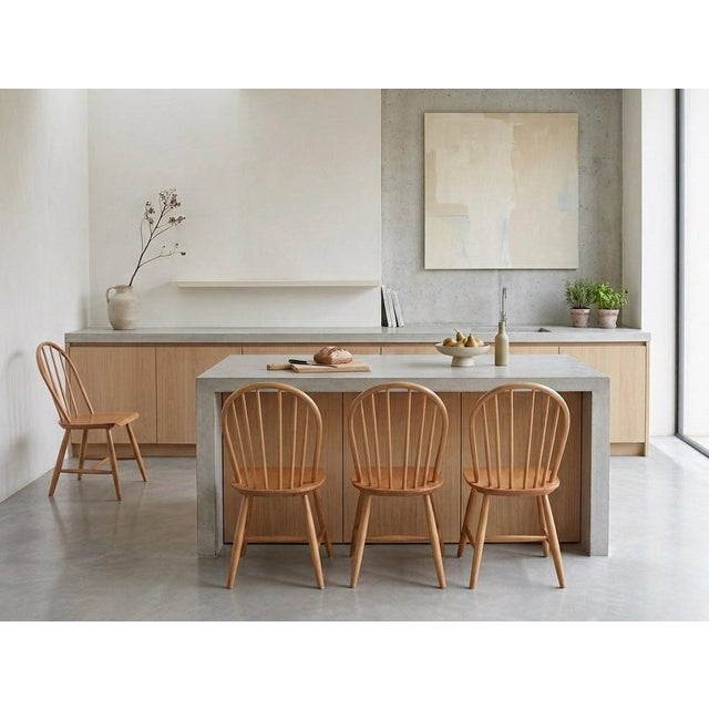 Beautiful set of four classic dining chairs designed by Erik Ole Jørgensen for Tarm Stole in the 1960s. Crafted in teak...