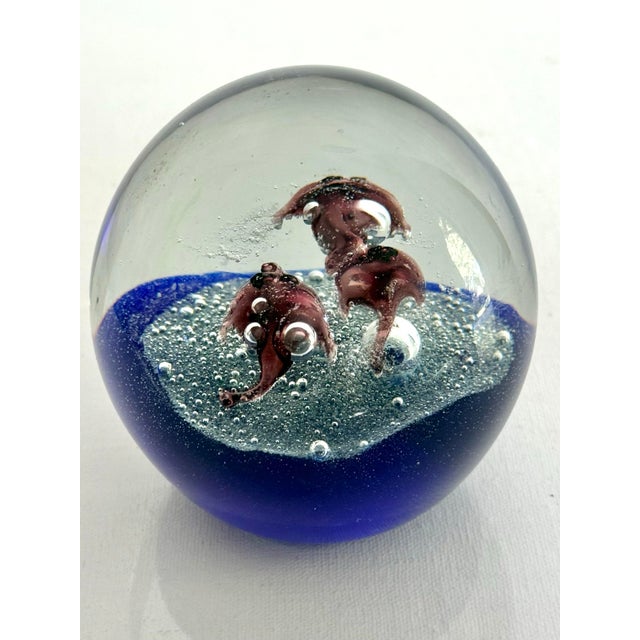 Art glass fish paper weight with sea life design in cool tones of blues and purples. Most items found at Pub & Oasis are...