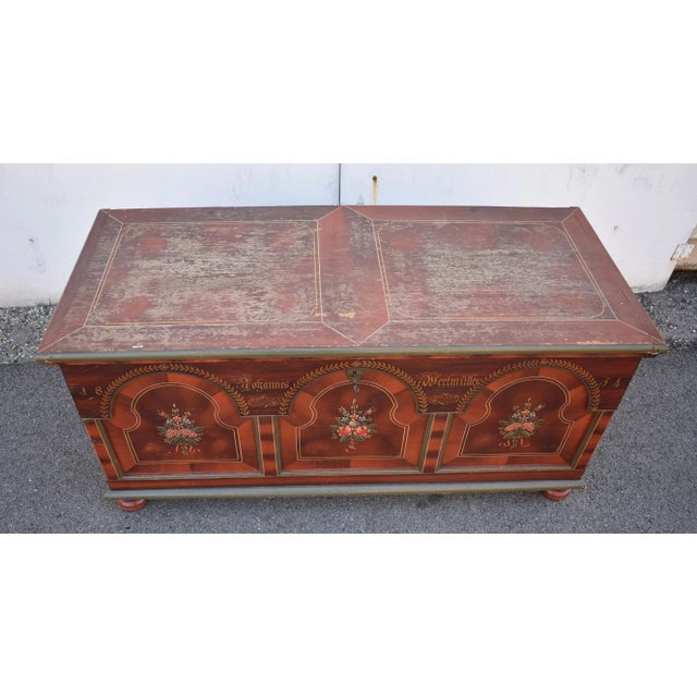 Shades of red fading and blending into each other in a stylized grain pattern are used to beautiful effect in the...