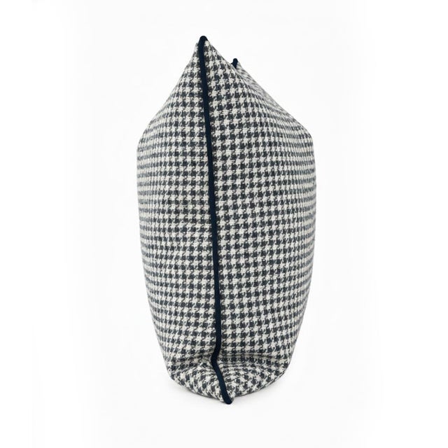 This fabric features a modern twist on a classic houndstooth pattern, woven in rich navy and ivory tones. The textured...
