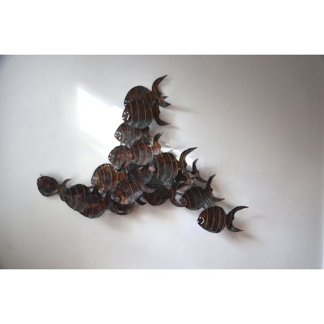 An incredible vintage Brutalist school of fish wall hanging sculpture in torch cut metal and copper. This large scale...