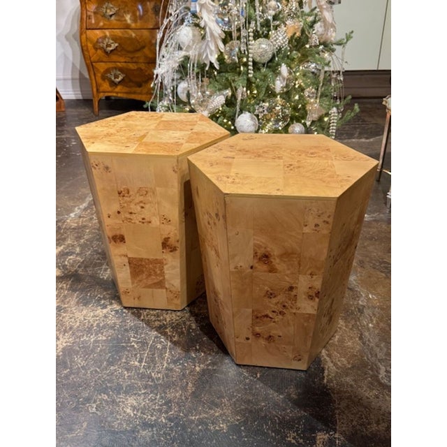 The product is a pair of Italian MCM Burl Elm Hex Tables, featuring a sleek and stylish design inspired by mid-century...
