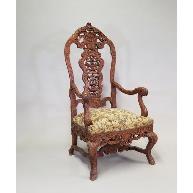 Pair of Circa 1870 Louis XV Renaissance Style Walnut Armchairs. These marvelous chairs feature high carved backs with...